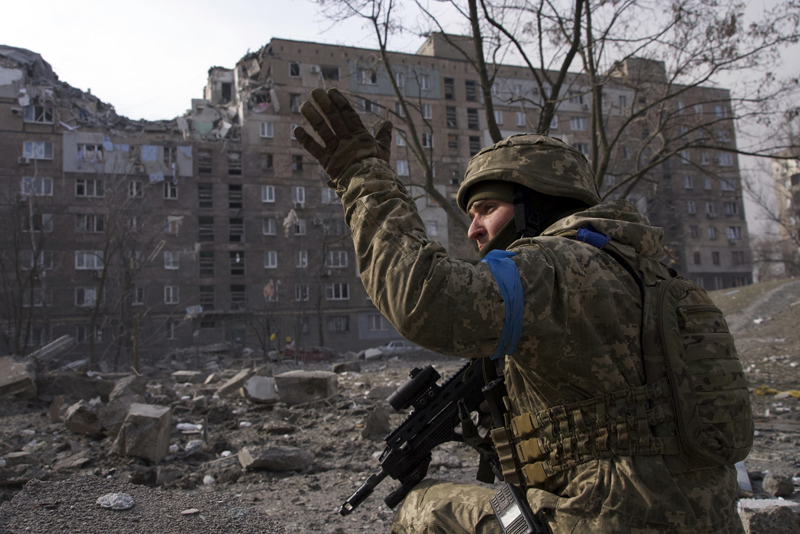 A Ukrainian serviceman guards his position in Mariupol, Ukraine, Saturday, March 12, 2022. (AP Photo/Mstyslav Chernov)
